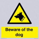 beware-of-the-dog-with-dog-warning-symbol~